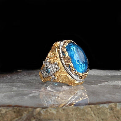 Ephesus Jewelry - Blue Topaz Ring Gold Plated with Side Ornaments: 9 3/4 US